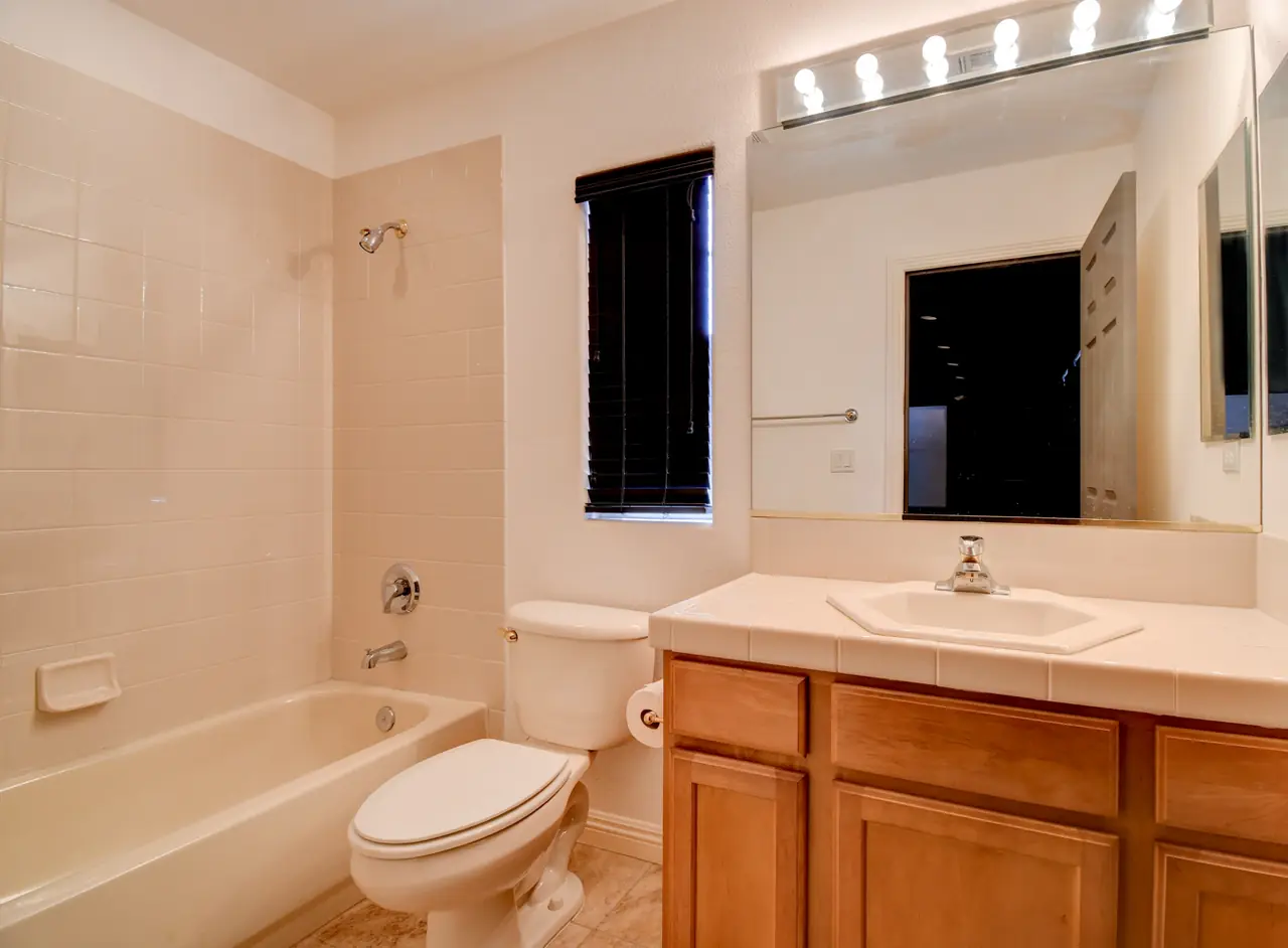 Guest bathroom with tub and vanity