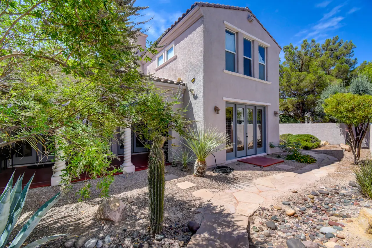Two-story rear wing with desert landscaping and cactus